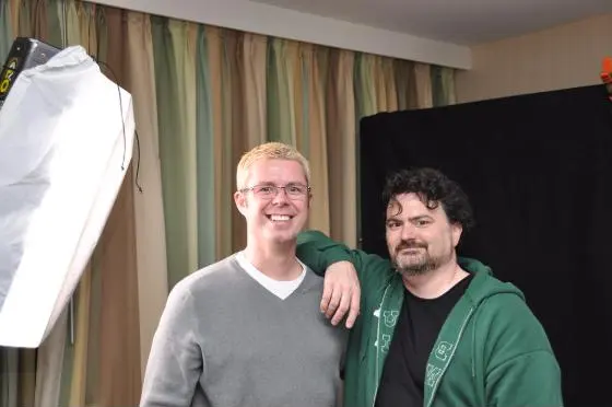 Chris Melissinos and Tim Schafer posing together next to a studio light