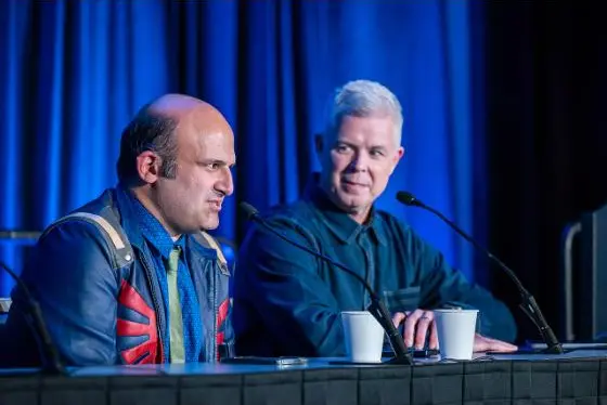 Chris Melissinos and Amir Satvat seated on stage at a panel table at GDC 2026